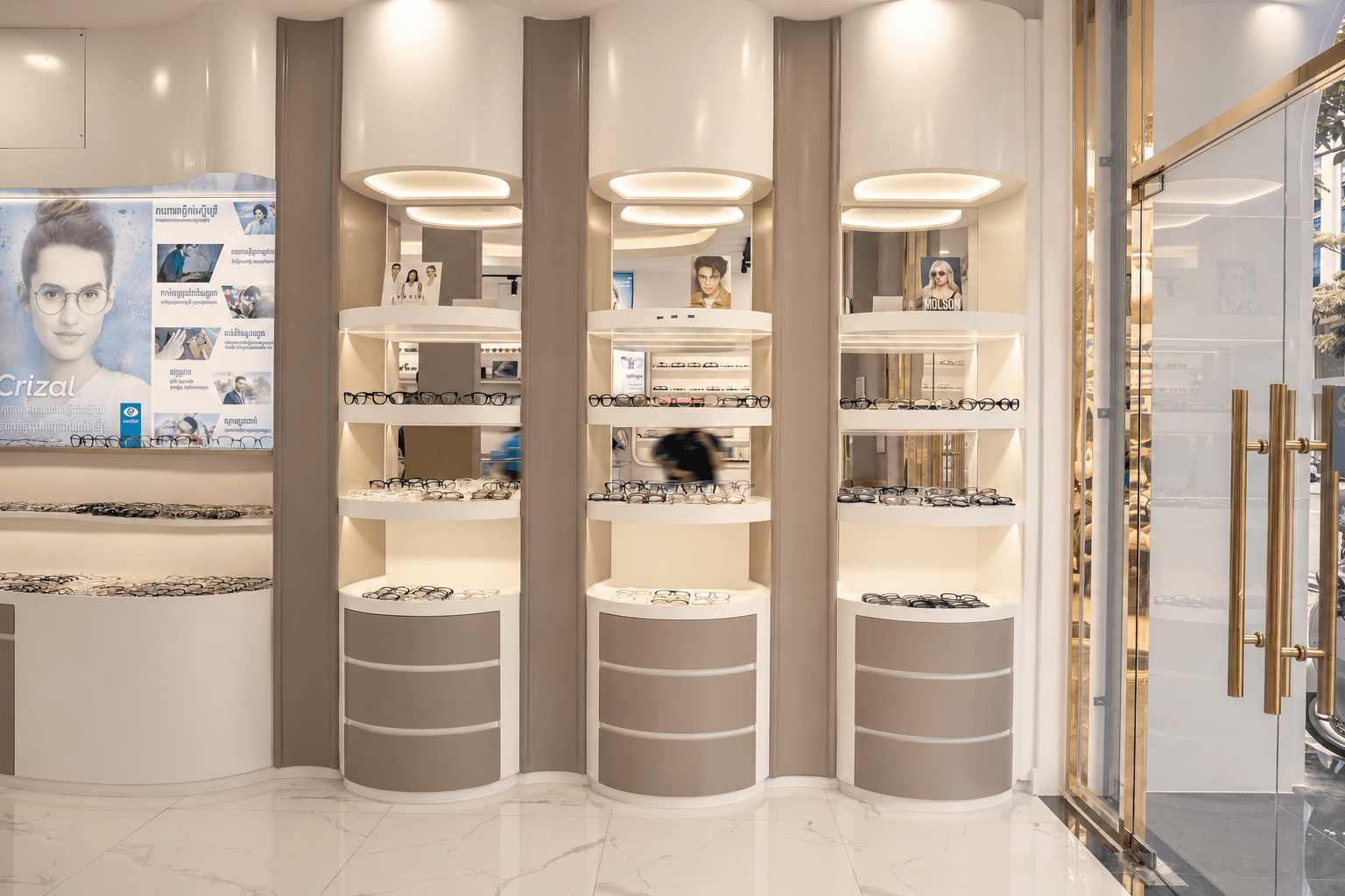 Inside M-Optic eyewear boutique in Phnom Penh Cambodia with designer glasses display shelves